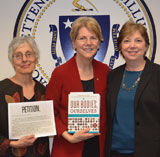 Judy Norsigian, Senator Elizabeth Warren and Diana Zuckerman delivering books